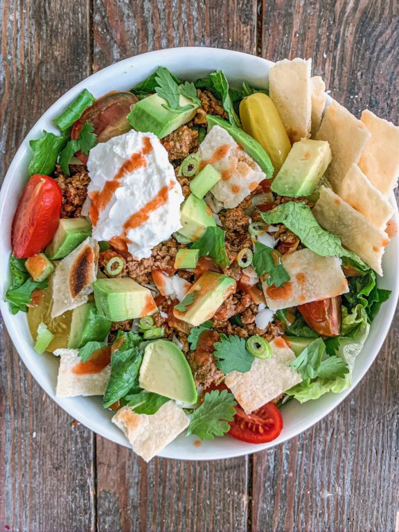 https://www.crossfit.com/wp-content/uploads/2022/02/10102733/Taco-Salad-Bowl-576x768.jpg