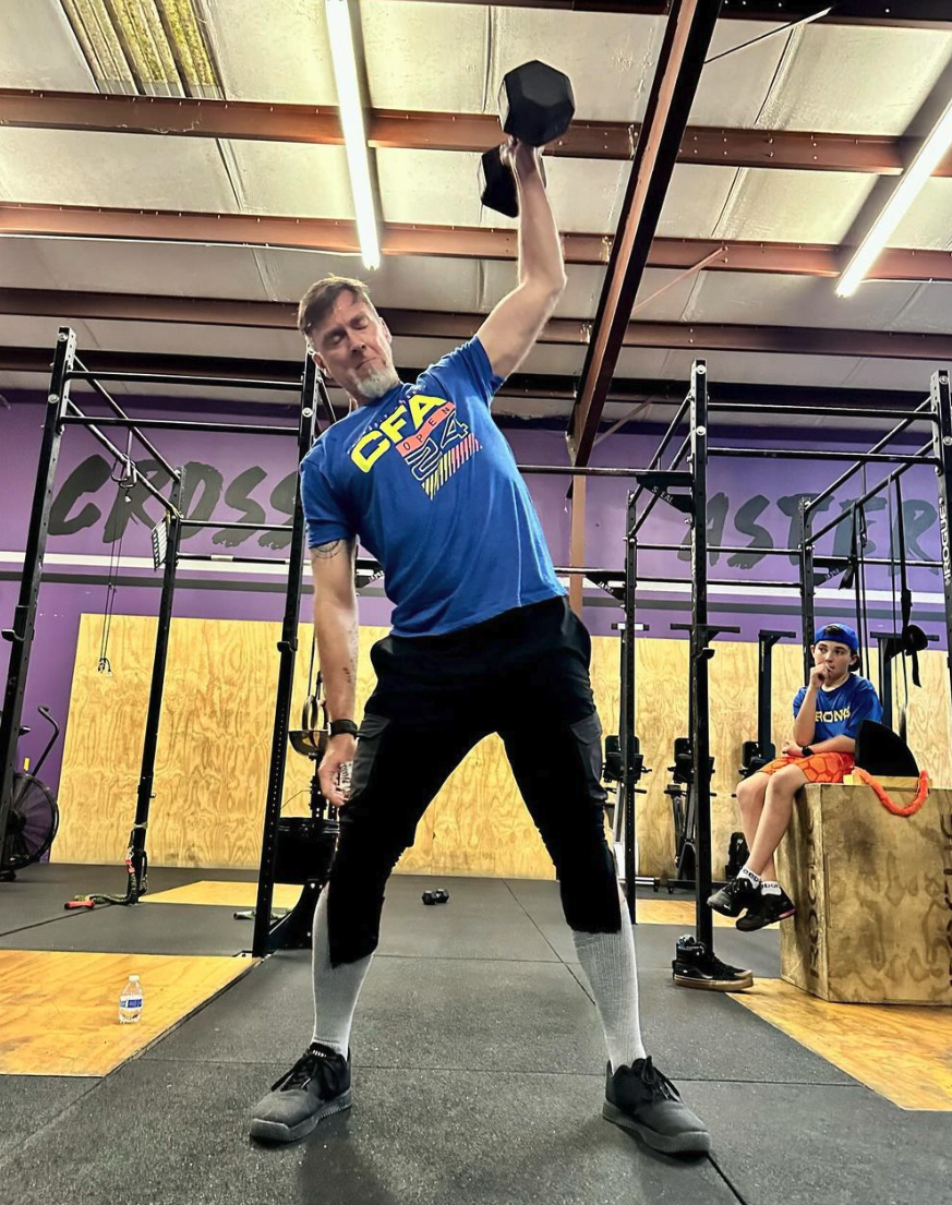 Steven Smith performs dumbbell snatches in the 2024 CrossFit Open