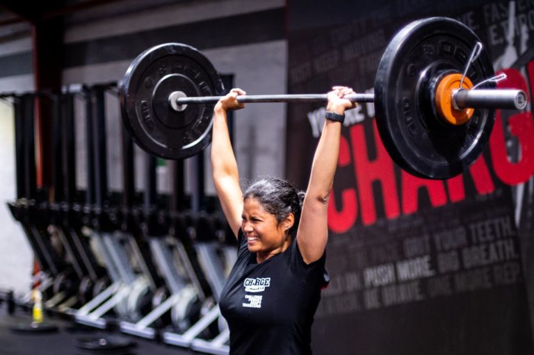 Athlete with barbell overhead