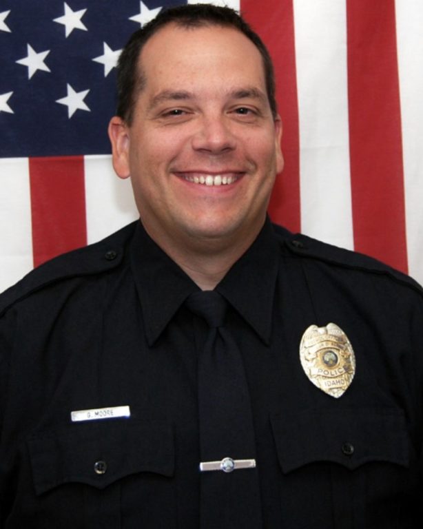 Headshot of Greg Moore in his police uniform