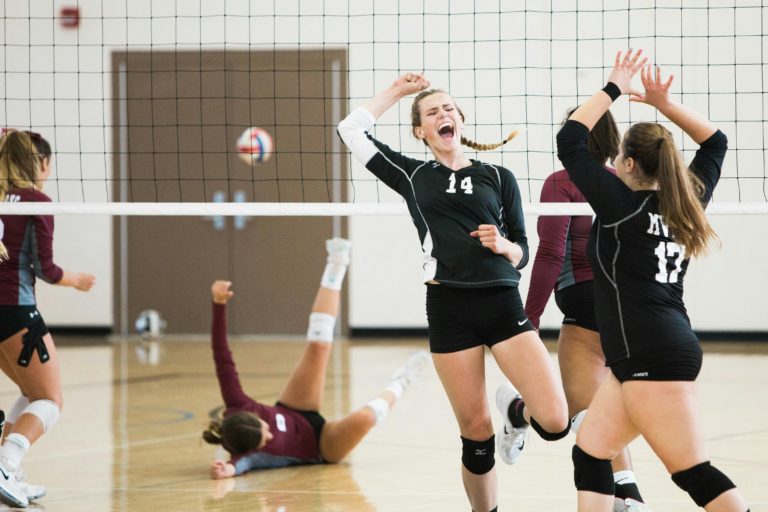 volleyball player celebrating a hit