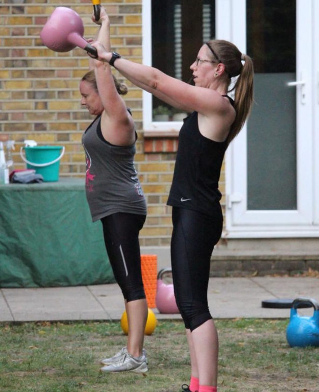 Abi Wynn-Jones swinging a Kettlebell