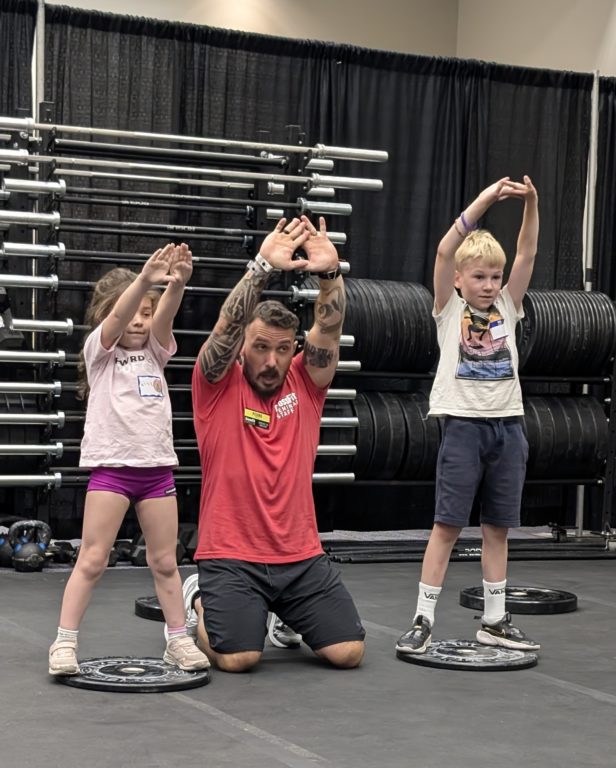 image of CrossFit kids coach teaching kids